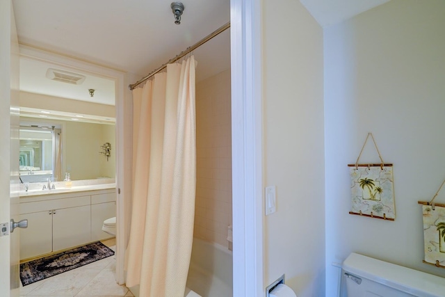 full bathroom featuring tile patterned flooring, shower / bath combination with curtain, vanity, and toilet