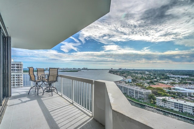 balcony featuring a water view