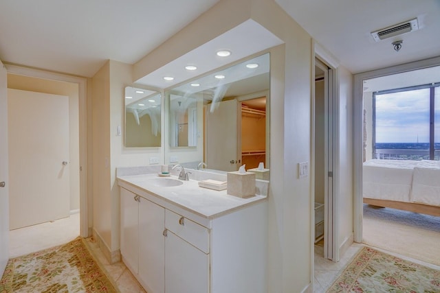 bathroom with tile patterned floors and vanity