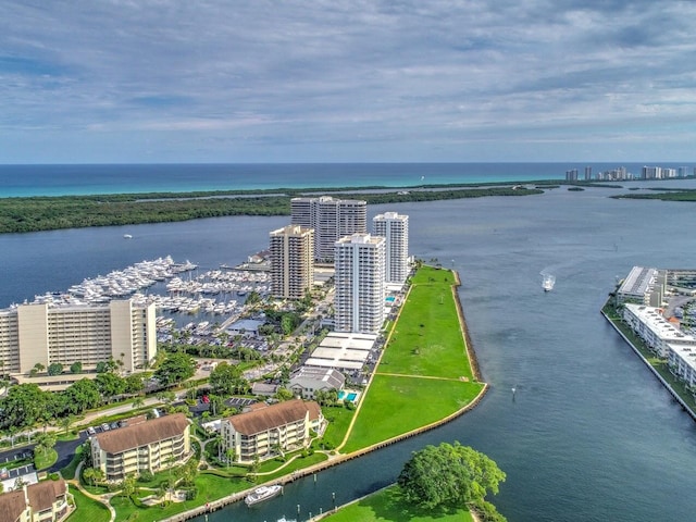 birds eye view of property with a water view