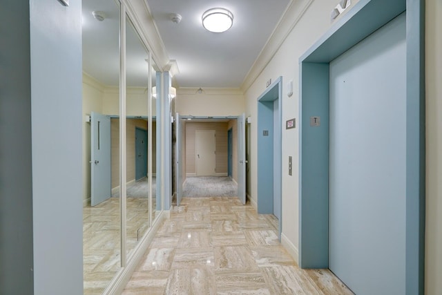 corridor featuring ornamental molding and elevator