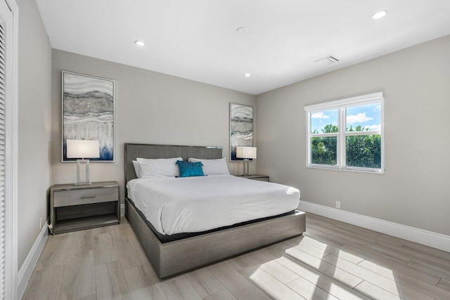 bedroom with light hardwood / wood-style flooring