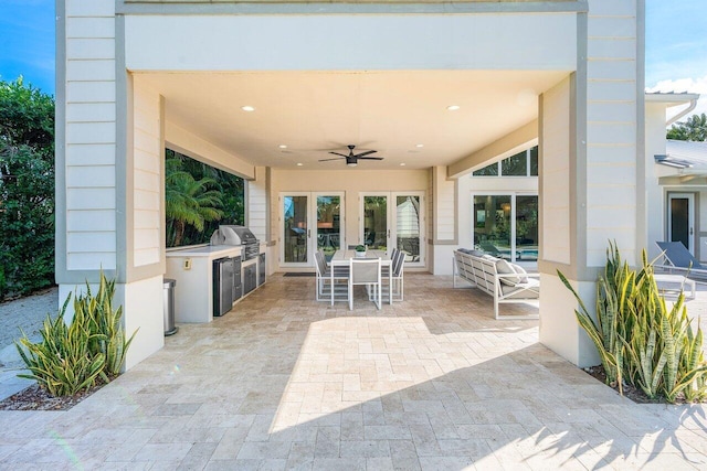 view of patio featuring grilling area, area for grilling, and ceiling fan