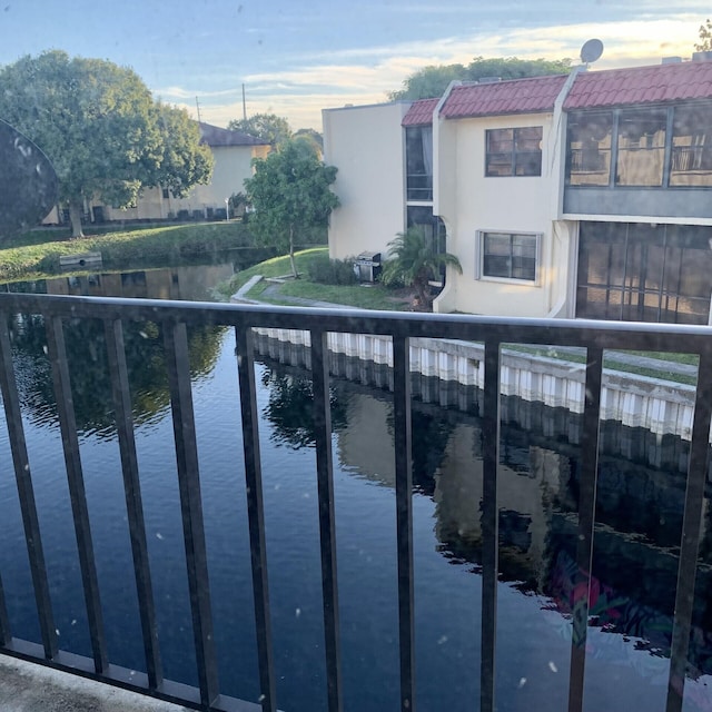 balcony featuring a water view