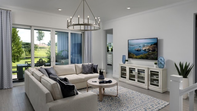 living room featuring light hardwood / wood-style flooring, ornamental molding, and a notable chandelier