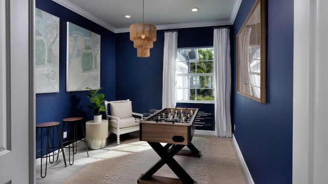 sitting room featuring ornamental molding