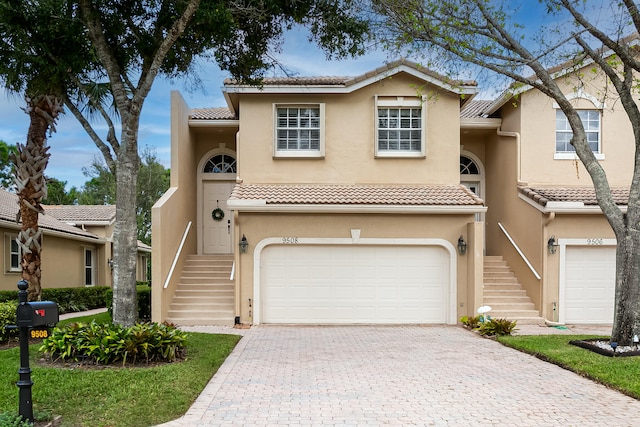 mediterranean / spanish house with a garage