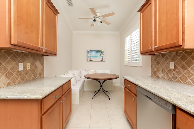 kitchen with tasteful backsplash, light tile patterned floors, stainless steel dishwasher, and ornamental molding