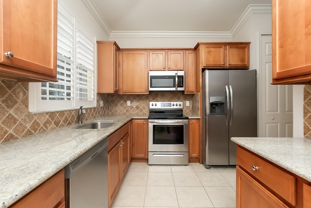 kitchen with light stone countertops, backsplash, stainless steel appliances, sink, and light tile patterned floors