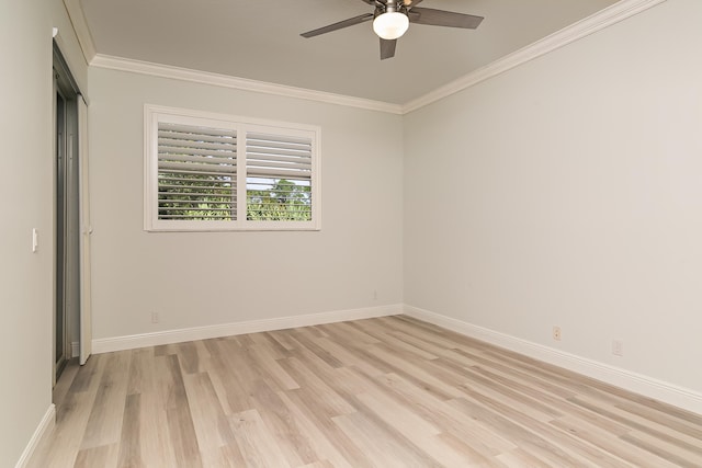 spare room featuring ceiling fan, light hardwood / wood-style floors, and ornamental molding