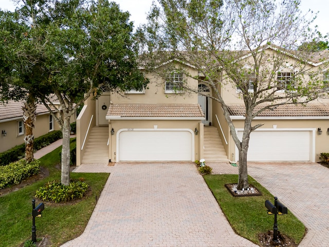 mediterranean / spanish-style home featuring a garage