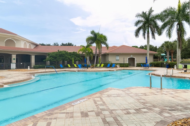 view of swimming pool with a patio