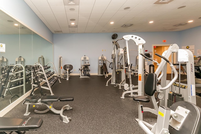 exercise room with a drop ceiling