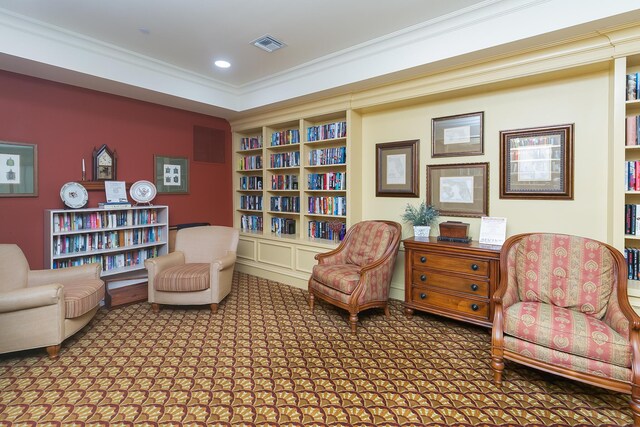 living area featuring carpet floors, crown molding, and a tray ceiling