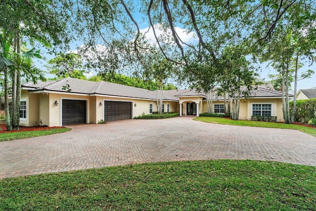 single story home with a garage