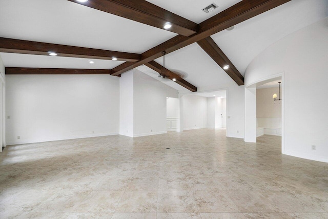 unfurnished living room with vaulted ceiling with beams