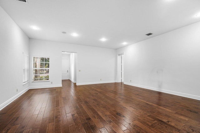 spare room with dark hardwood / wood-style floors