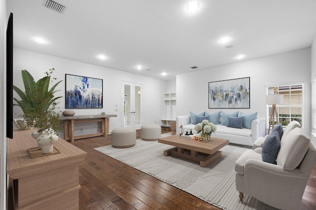 living room featuring dark hardwood / wood-style floors and french doors