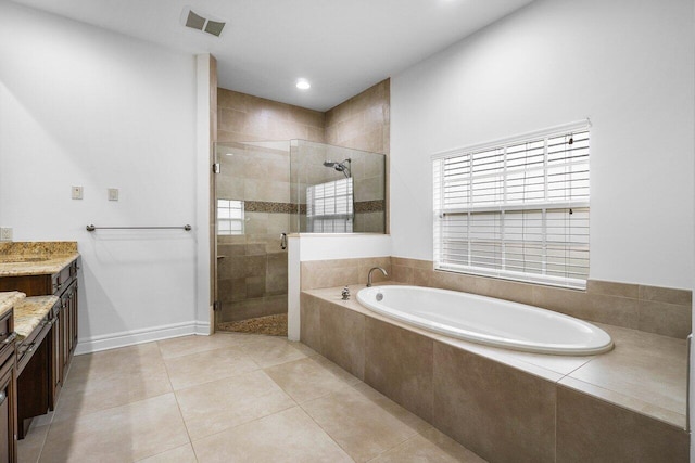 bathroom featuring tile patterned floors, vanity, and separate shower and tub