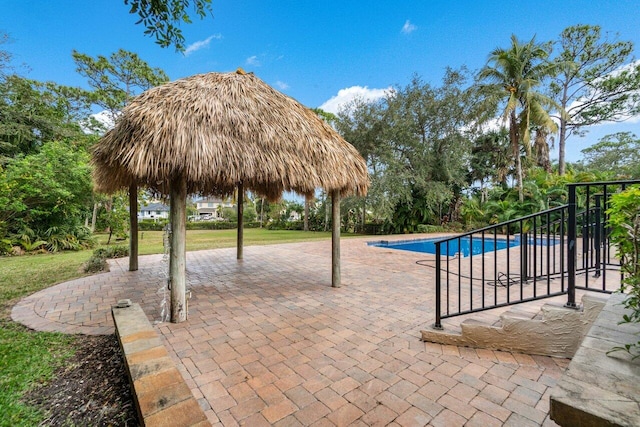 view of pool featuring a gazebo and a patio