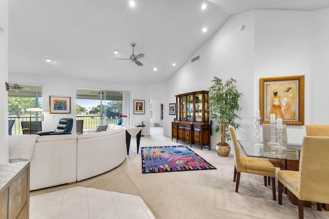 carpeted living room featuring high vaulted ceiling and ceiling fan