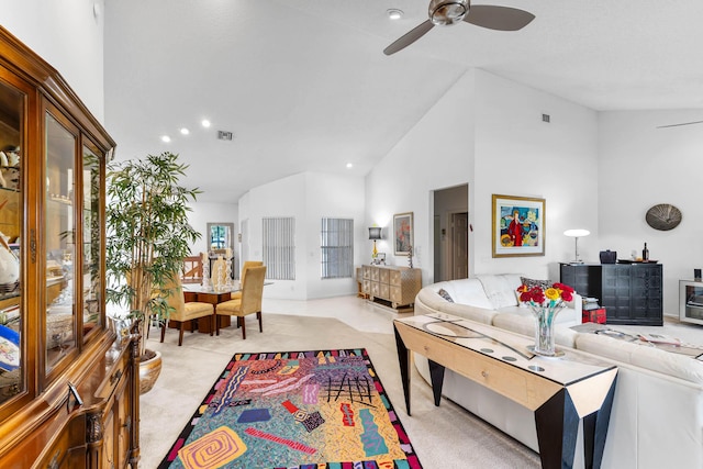 living room with ceiling fan and high vaulted ceiling