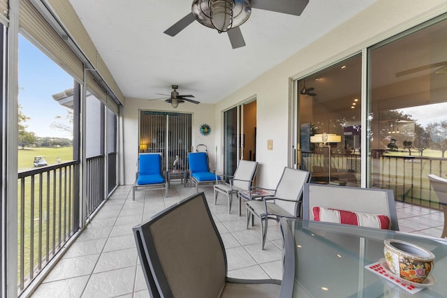 sunroom / solarium with ceiling fan