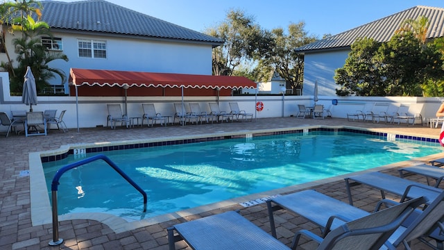 view of swimming pool featuring a patio area