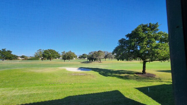 surrounding community featuring a yard