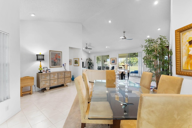 dining room featuring light tile patterned floors, high vaulted ceiling, and ceiling fan