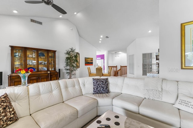 living room with ceiling fan and lofted ceiling