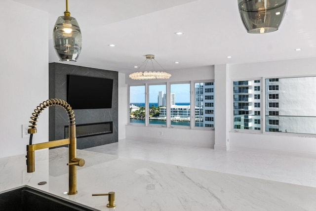 interior space with pendant lighting and sink