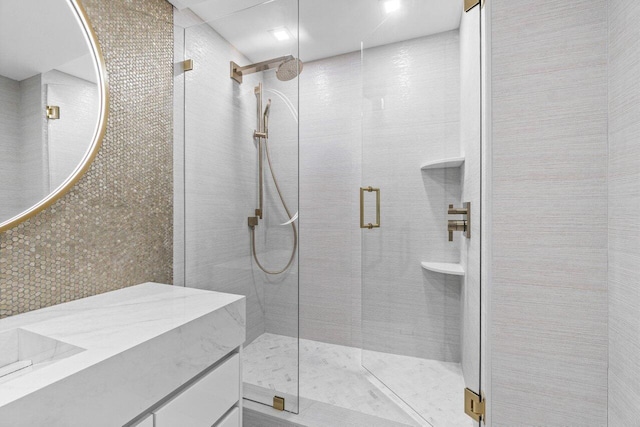 bathroom with vanity and walk in shower