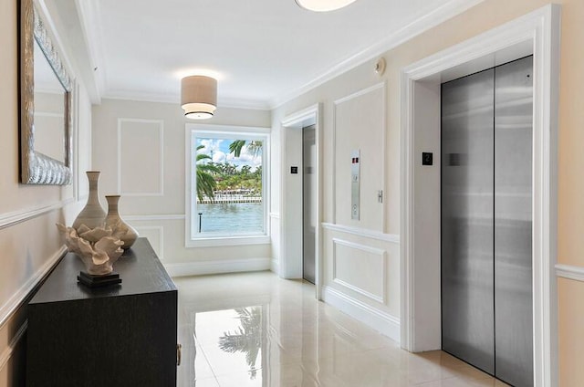 doorway with elevator and crown molding