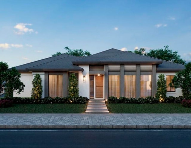 view of front of property with a front lawn