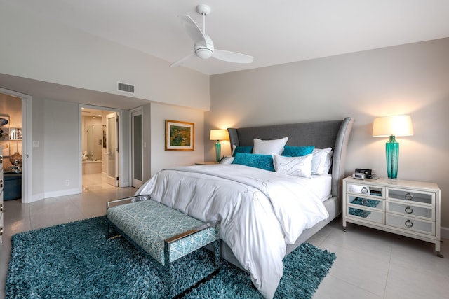 tiled bedroom with ceiling fan and ensuite bathroom