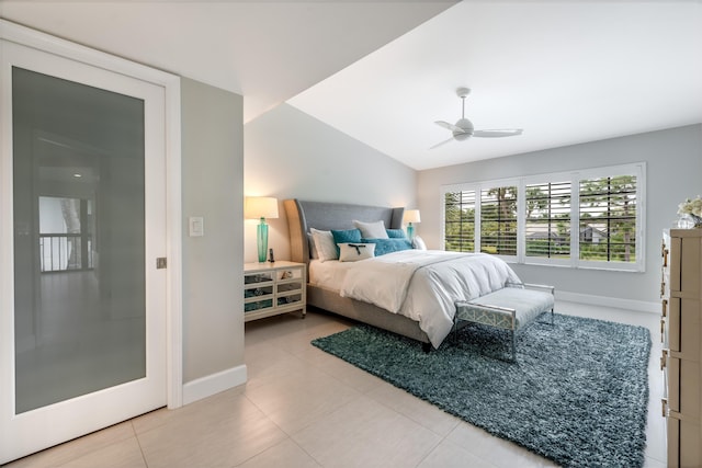 tiled bedroom with vaulted ceiling and ceiling fan