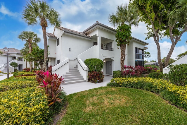 mediterranean / spanish-style house featuring a balcony