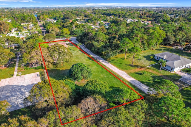 drone / aerial view featuring a view of trees