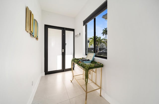 hallway featuring light tile patterned floors