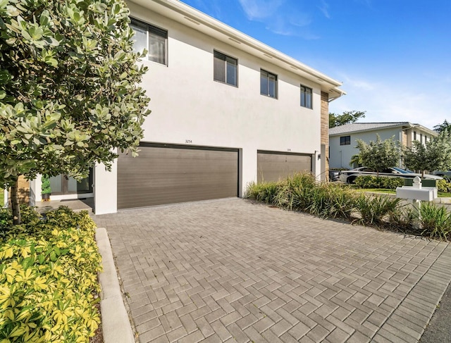 view of front of property featuring a garage