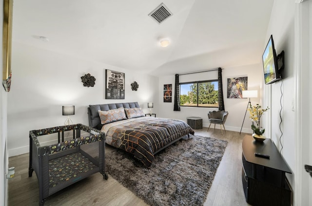 bedroom with wood-type flooring