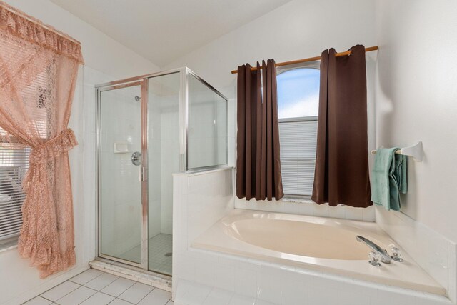 bathroom featuring tile patterned flooring and independent shower and bath