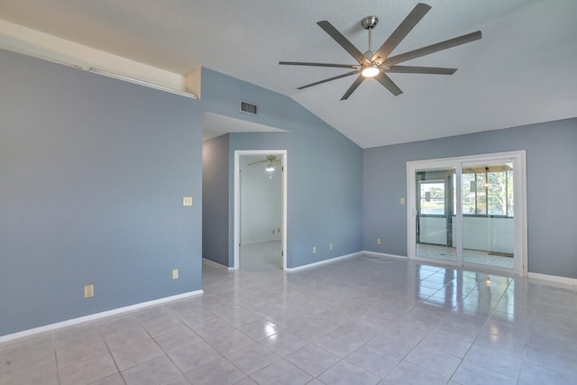 tiled spare room featuring ceiling fan and lofted ceiling