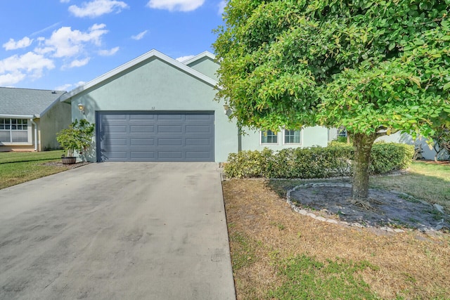 view of front of house with a front lawn and a garage