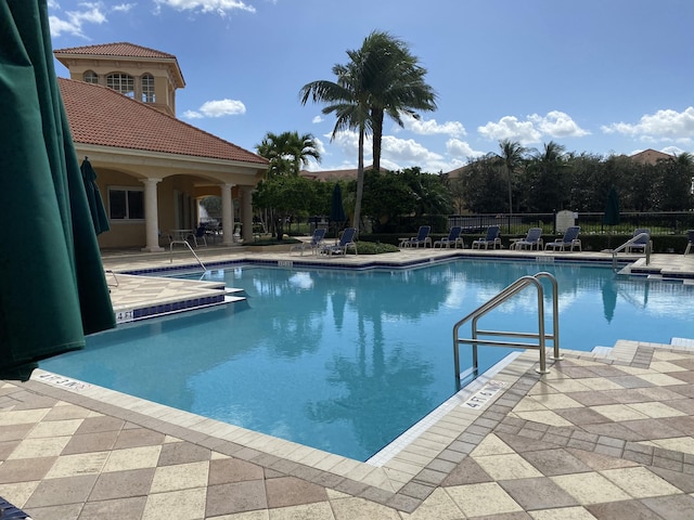 view of swimming pool featuring a patio area