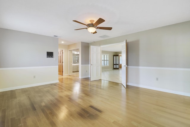 unfurnished room featuring ceiling fan and light hardwood / wood-style floors