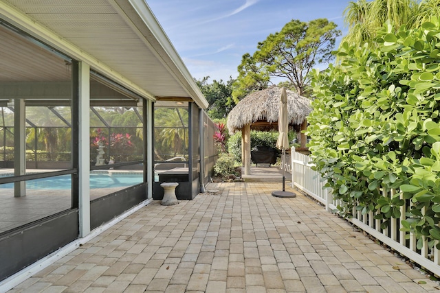 view of patio with a gazebo and a lanai