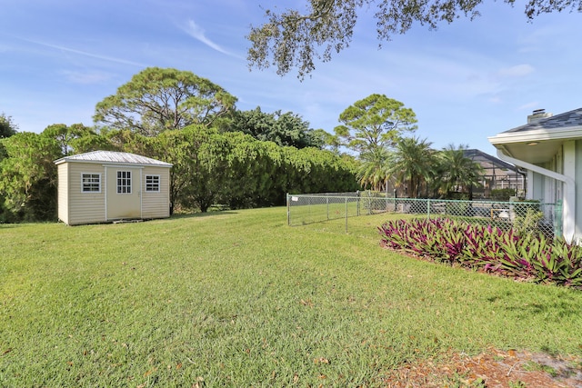 view of yard featuring a storage shed and a lanai