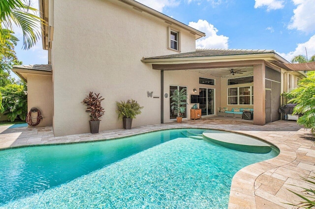 view of pool featuring ceiling fan and a patio